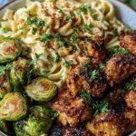 Maple Garlic Chicken Bites with Spicy Cajun Alfredo & Crispy Brussels Twists