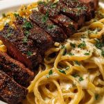 Cajun Garlic Butter Steak over Creamy Parmesan Linguine