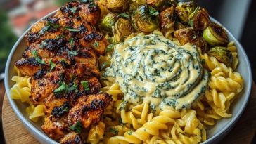 Hot Honey Cajun Chicken Alfredo with Basil Feta Swirl & Crispy Brussels Chips