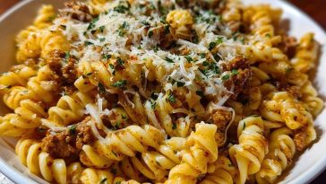 Cheesy Garlic Twisted Pasta with Cajun Ground Beef and Alfredo Velveeta