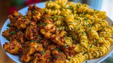 Chili Garlic Butter Chicken Bites with Creamy Cajun Corn Alfredo Twists