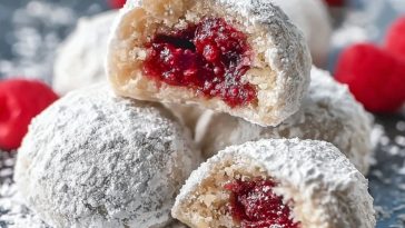 Raspberry-Filled Almond Snowball Cookies